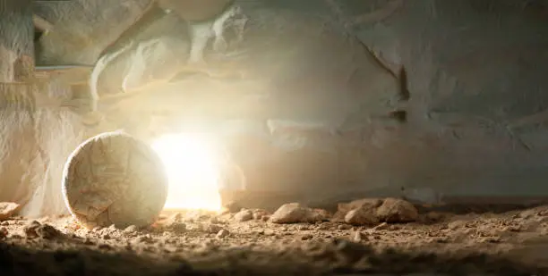 Photo of Jesus Christ resurrection. Christian Easter concept. Empty tomb of Jesus with light. Born to Die, Born to Rise. 