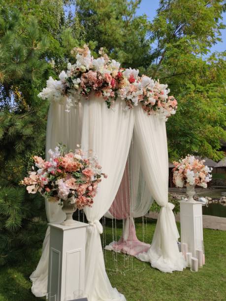 istock arch for a wedding ceremony with flowers in park 1243066071