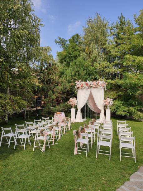 istock arch for a wedding ceremony with flowers in park 1243067161