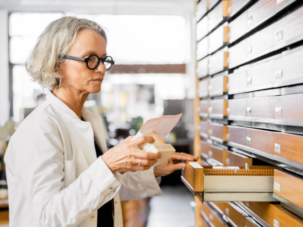 istock Mature female pharmacist working in store 1243068290