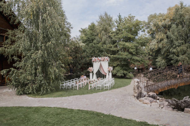 istock arch for a wedding ceremony with flowers in park 1243070089