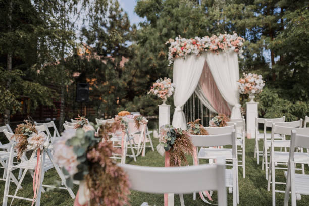 istock arch for a wedding ceremony with flowers in park 1243072878