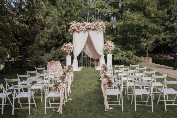 istock arch for a wedding ceremony with flowers in park 1243073396