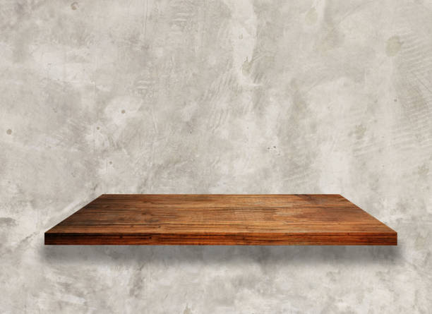 istock Wooden shelf over white concrete wall background 1243075108