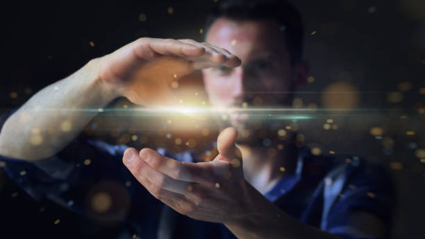 istock Portrait of a young guy who is using the futuristic latest innovation technology with augmented reality hologram 1243076751
