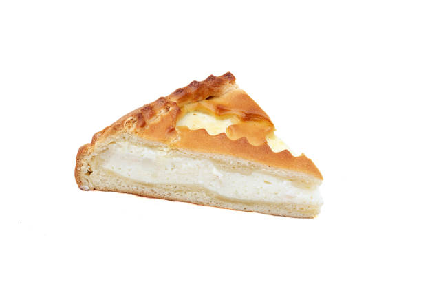 istock Triangular piece of the pie pastry with cottage cheese filling. Close-up on white background 1243081385