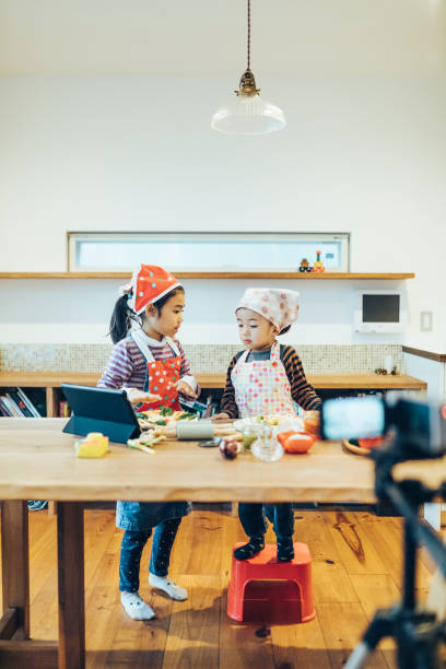 istock Children watching cooking instructions from the internet. 1243081414