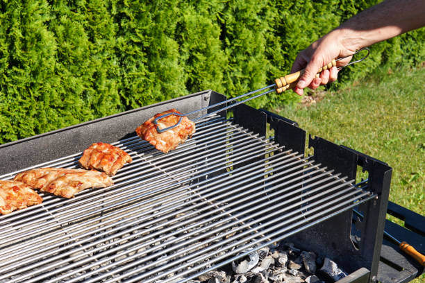 istock barbecue tong that is holding fresh meat 1243092768