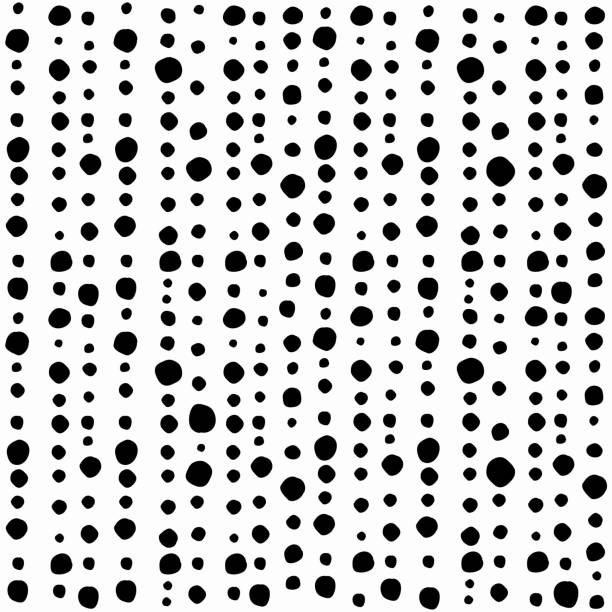 istock Seamless abstract pattern of little black shabby dots or spots on white. 1243094585