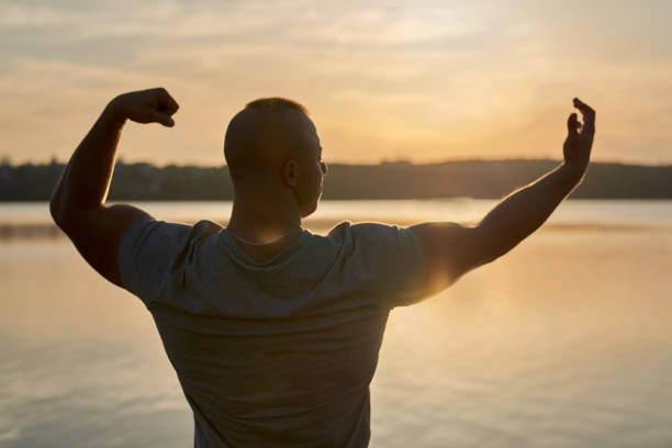 istock Muscle man at the beach 1243099593