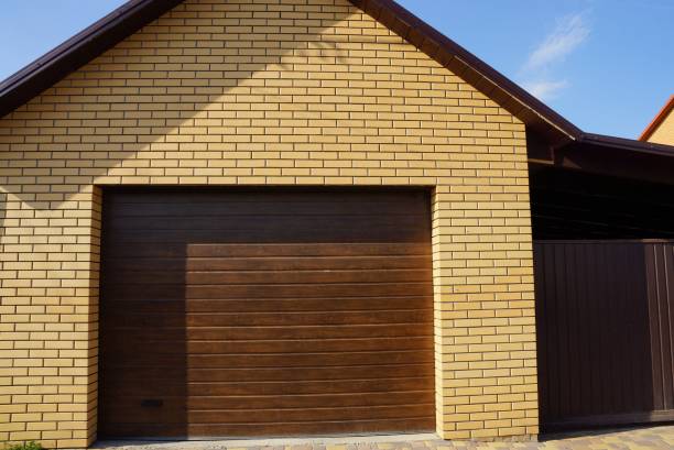 istock facade of a brown garage with a closed gate 1243102947