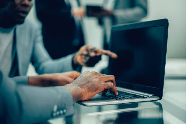 istock close up. business colleagues using a laptop in the workplace 1243123356