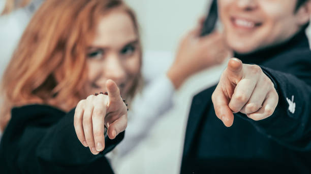 istock close up. young business people pointing at you 1243126791