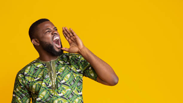 istock Emotional black guy shouting towards copy space 1243128349