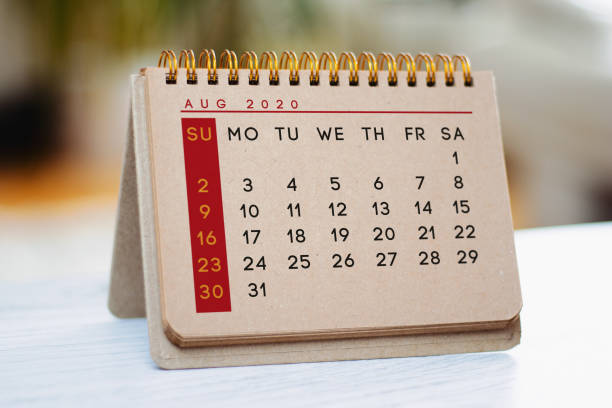 istock Kraft August calendar is on the table. 1243130023