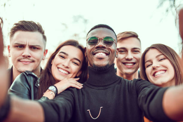 istock Selfie For Cute Smiling Friends In Park 1243134875