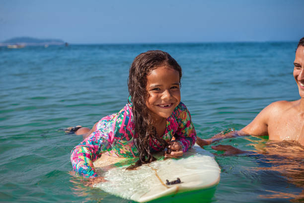 istock Father and daughter surf day 1243144228
