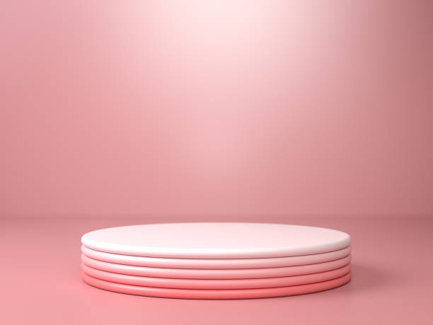 istock Round pink gradient stage, podium or pedestal over pink paper background in studio. 3D illustration. Background or mockup for cosmetics or fashion. Use for product identity, branding and presenting. Place your object or product on pedestal. 1243144361