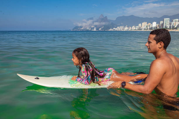 istock Father and daughter surf day 1243144831