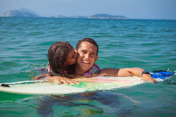 istock Father and daughter surf day 1243145929