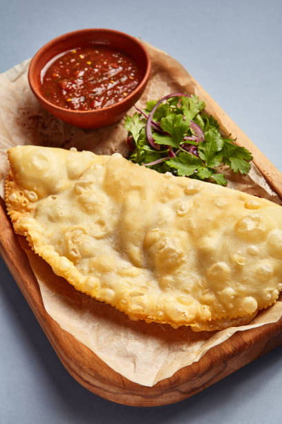 istock Cheburek with tomato sauce and parsley 1243147583