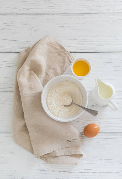istock Ingredients for making pancakes butter flour milk egg, top view, selective focus 1243153125