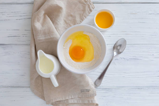 istock Ingredients for making pancakes, butter, flour, milk, egg, top view 1243153164