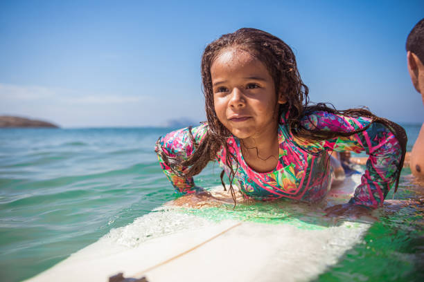 istock Beautiful little surfer on surfboard 1243155991