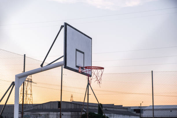 istock basketball court in a sunset 1243157101