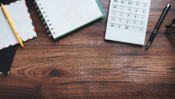 istock calculator and letters on desk 1243158182