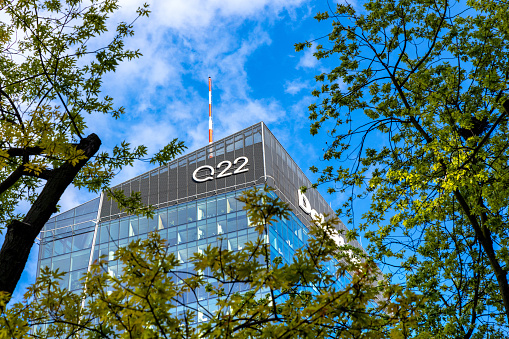 Warsaw, Mazovia / Poland - 2020/05/22: Panoramic view of Q22 office tower of Echo Investment at al. Jana Pawla II avenue in Wola downtown district