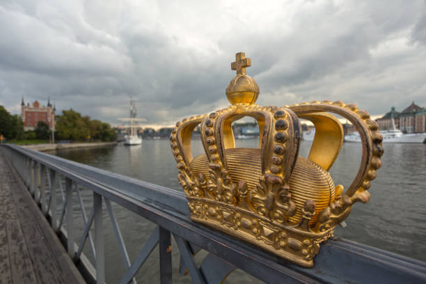 istock Golden Crown on Skeppsholm Bridge, Sweden 1243163297