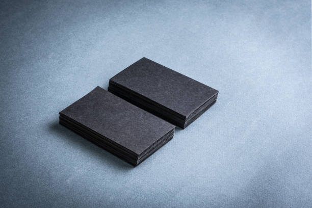 istock Stacks of black blank business cards 1243169843