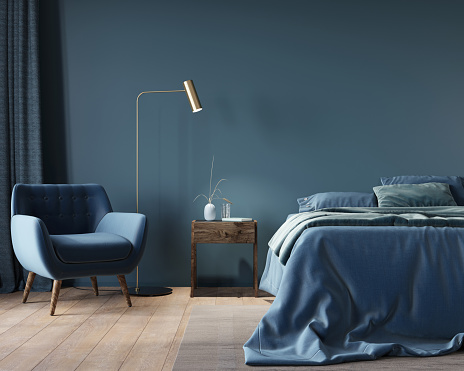 The interior of the bedroom in dark blue with a wide bed, a wooden nightstand and a golden floor lamp / 3D illustration, 3d render