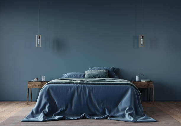 the interior of the bedroom in dark blue with a wide bed - showcase interior inside of domestic room indoors imagens e fotografias de stock