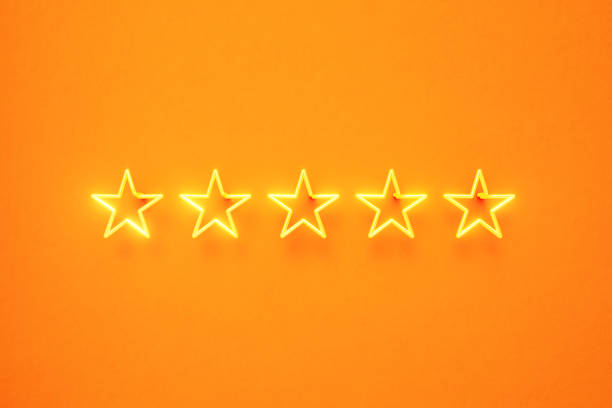 Five Star Written by Yellow Neon Light on Yellow Background Five star written by yellow neon light on yellow background. Horizontal composition with copy space. Front view. First class and luxury concept. first class photos stock pictures, royalty-free photos & images