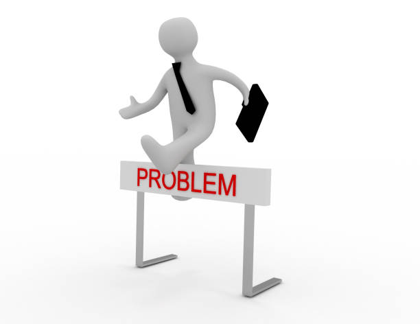istock Businessman jumping over a hurdle obstacle titled Problems 1243206645