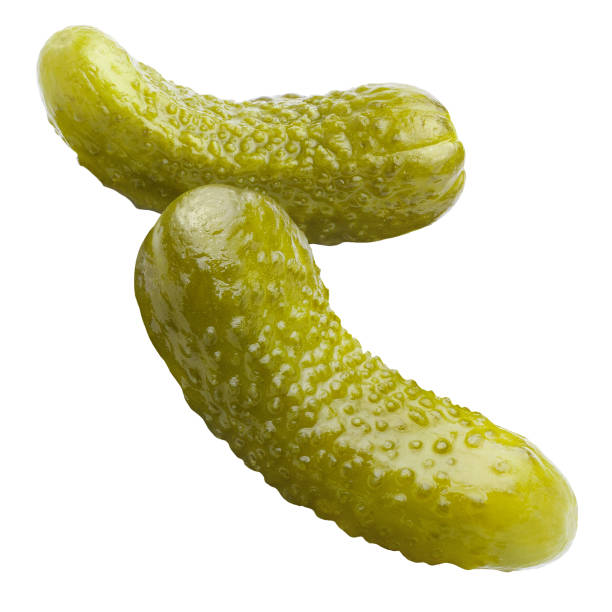 istock Close-up of two marinated pickled cucumbers on white 1243208869