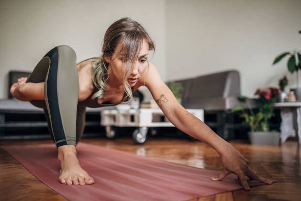 istock One woman practice yoga at home 1243210127