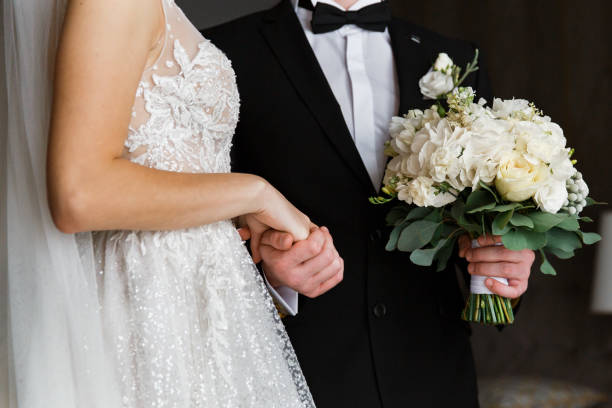 istock Couple. You can see the hands touching each other. 1243222432