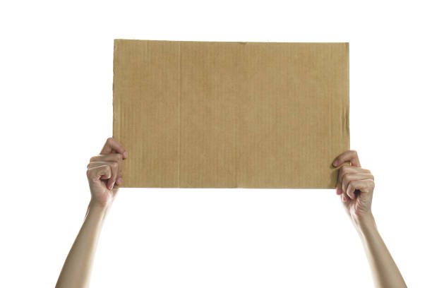 istock Woman hand holding a blank placard to put the text. 1243236853