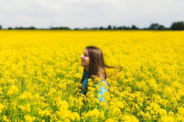istock Felling happiness hidden in the yellow flower field 1243245497