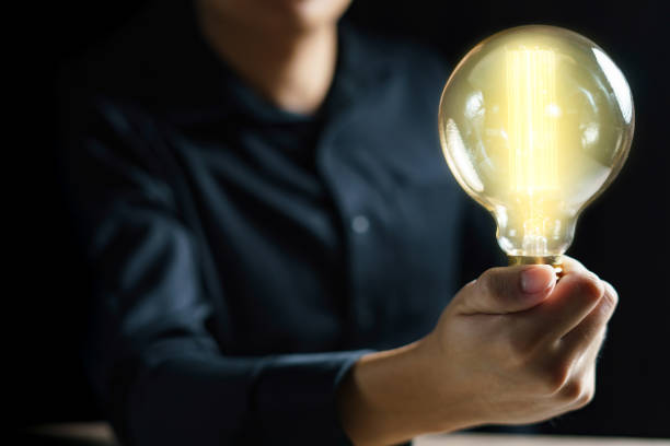 istock Man hand holding light bulb. idea concept with inspiration. 1243246148