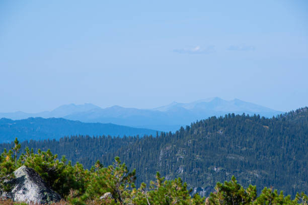 istock mountain valley with hills on horizon in blue haze 1243246261