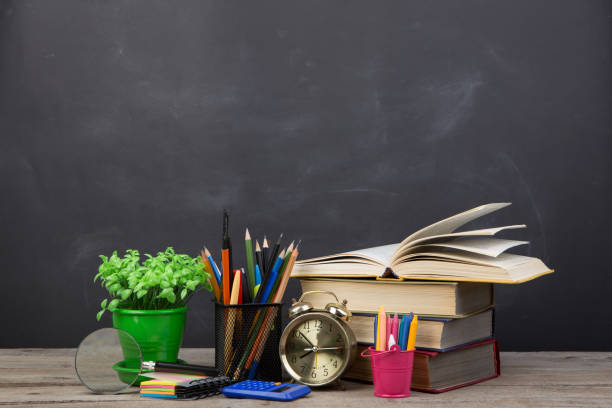 istock Education concept - books on the desk in the auditorium 1243247138