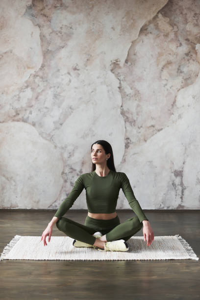 istock Young woman resting after yoga practice 1243247153