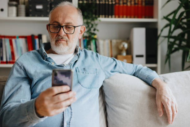 istock Senior man addicted to social media texting 1243248492