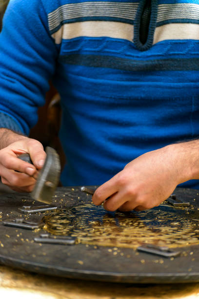 istock Hands of Craftsman Engraving Masterpiece 1243249096