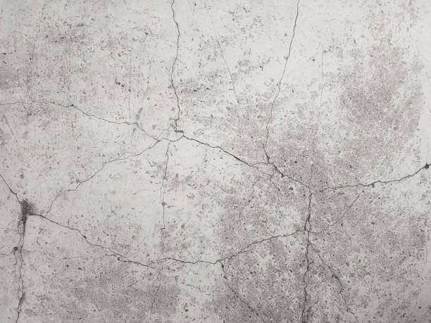istock Cracked concrete wall texture, Cement background not painted in vintage style 1243250791