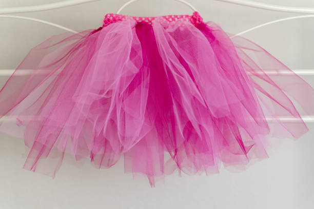 Pink tutu hanging up on clothes rail stock photo